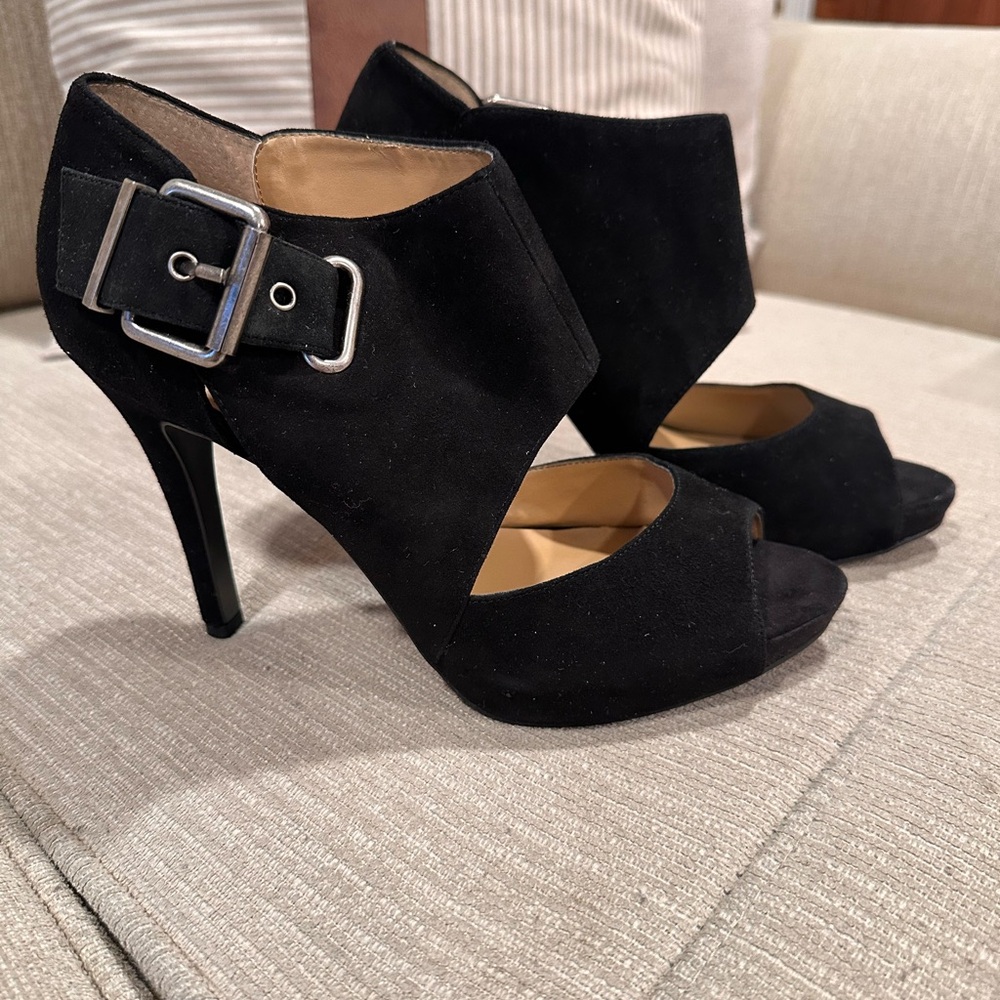 Nine West black suede high heels with an ankle strap.